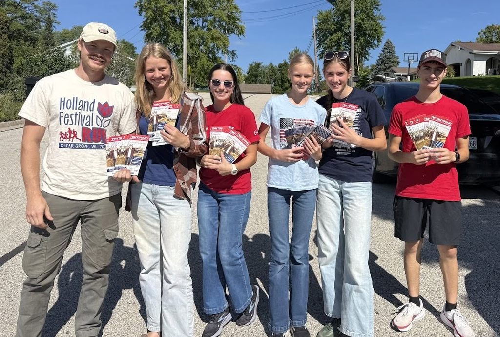 Six Save Wisconsin Saturday volunteers hold Tom Tiffany campaign literature before heading into a local neighborhood.